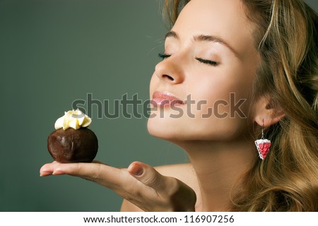 stock-photo-young-blonde-woman-eating-the-cake-116907256.jpg