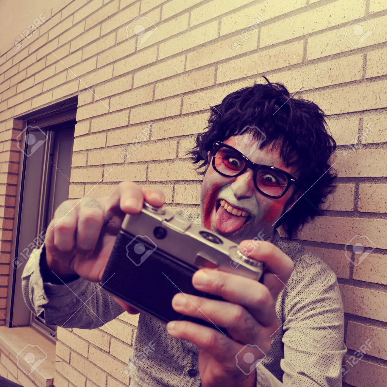 Scary hipster zombie taking a selfie retro.webp