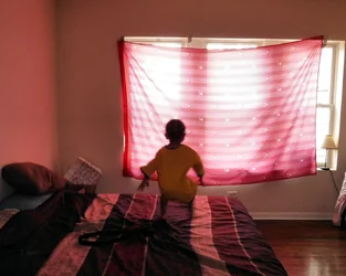 kid on bed.jpg SIG.webp