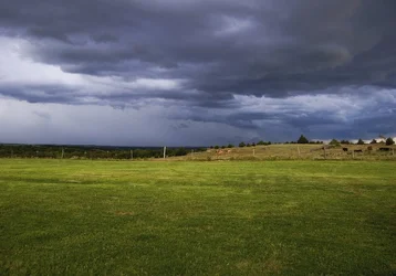 $storm_brewing_on_the_plain_by_samspade1941-d592oko.webp