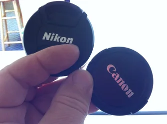 $NIKON vs Canon Lenscap Battle.webp $NIKON vs Canon Lenscap Battle.webp
