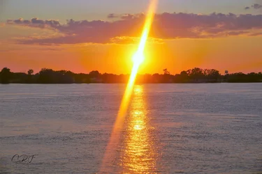 Mississippi sunset with flare jpg sig.webp