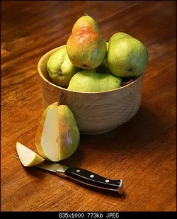 $Cut Pear with Pears in Wood Bowl.webp