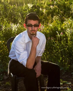 $Yisroel in a field - serious - 2 - 4x5 crop.webp