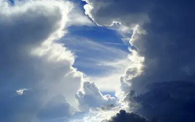$high-sun-cloudy-sky-photo-resolution-shining-through-world-dispersing-photography-photos.webp