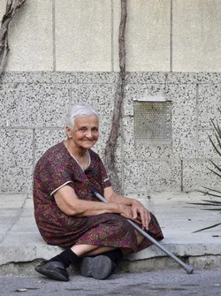 $Old_woman_on _pavement_web.webp