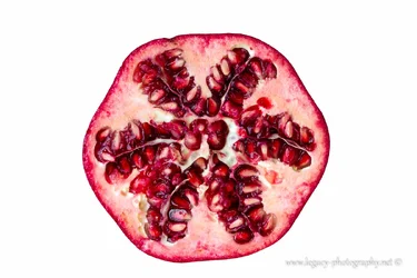 $Pomegranate half on white - 2.webp