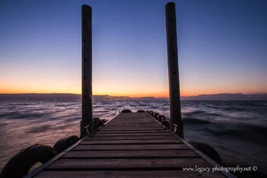 $Pier leading into the Kinneret and Tiberias at sunset - 2.webp