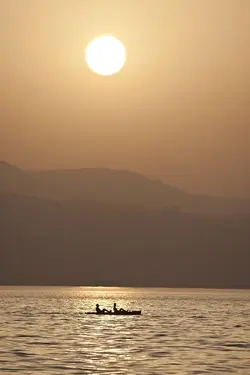 $Canoe at sunset on the Kinneret.webp