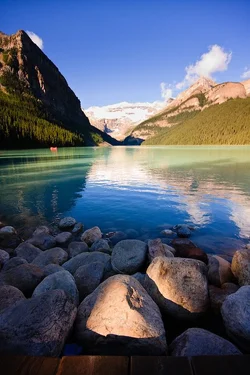 $Canada-Alberta-BanffNationalPark-LakeLouise-Early-Morning-Sun.webp