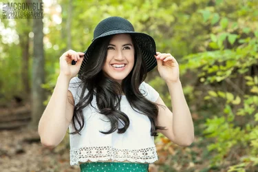 $senior-fashion-hat-outdoors-smiling.webp