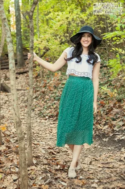 $senior-fashion-hat-skirt-woods.webp