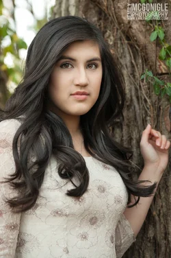 $senior-portrait-headshot-serious-tree.webp