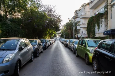 $2 rows of cars on a street late afternoon shadows.webp