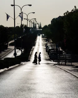 $RBS Ayalon street in the early morning - 2 women crossing silhouette.webp