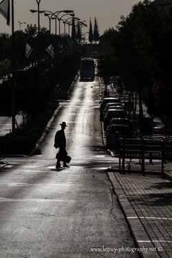 $RBS Ayalon street in the early morning - boy with hat and case crossing - silhouette.jpg