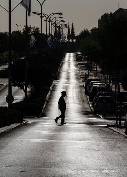 $RBS Ayalon street in the early morning - boy with hat crossing - silhouette.jpg