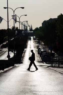 $RBS Ayalon street in the early morning - man crossing silhouette.jpg