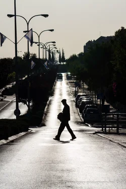 $RBS Ayalon street in the early morning - man crossing silhouette.webp