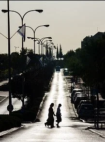 $RBS Ayalon street in the early morning - 2 women crossing silhouette.webp
