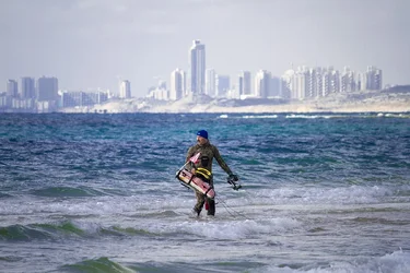 $Spear fisherman sharp heading into ocean Tel Aviv in the background - small.webp $Spear fisherman sharp heading into ocean Tel Aviv in the background - small.webp