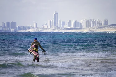 $Spear fisherman sharp heading into ocean Tel Aviv in the background moved - small.webp $Spear fisherman sharp heading into ocean Tel Aviv in the background moved - small.webp