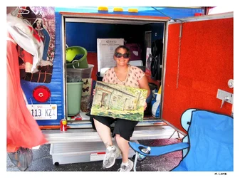 $110 lady back of truck.webp