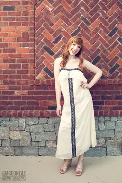 $brick-wall-white-dress-girl.webp
