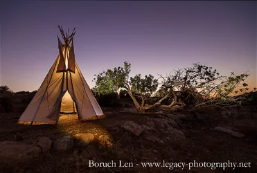 $Teepee at sunset with trees.webp