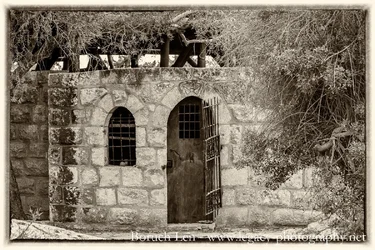 Old door and barred window - Sepia plus border.webp