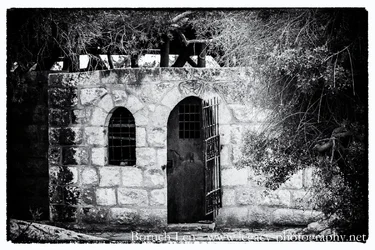 Old door and barred window B-W.webp