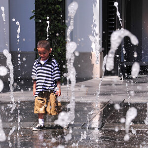 Little boy in fountain