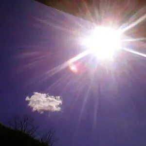 The sun smiles over mountains