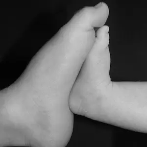 my Caiden and Piper. Sibling baby feet
