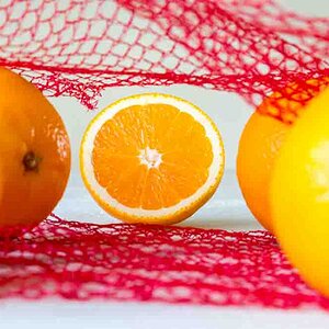 Oranges on a wooden table in the network