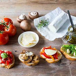 Bruschetta with beans and arugula, mushrooms, goat cheese