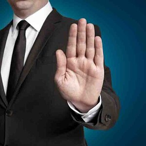 Hand stop shown by businessman
