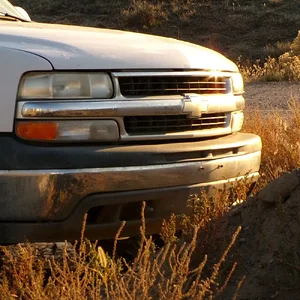 white truck at sunset.webp