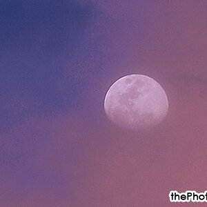 moon with dispersed clouds.