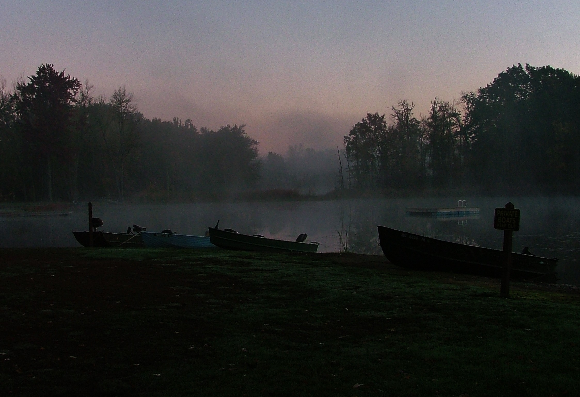 Morning boats in the mist.