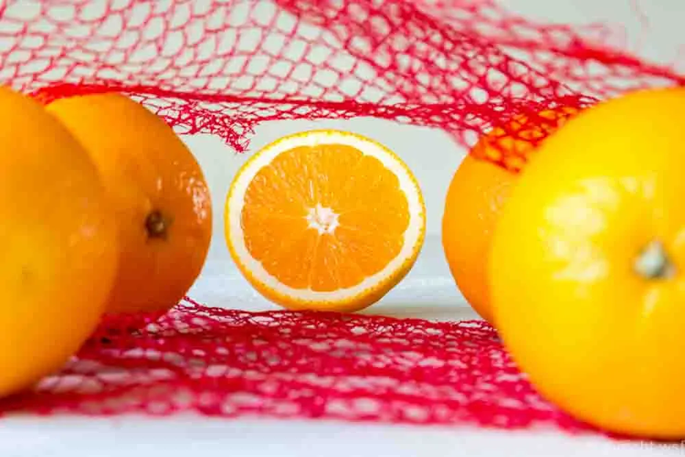 Oranges on a wooden table in the network