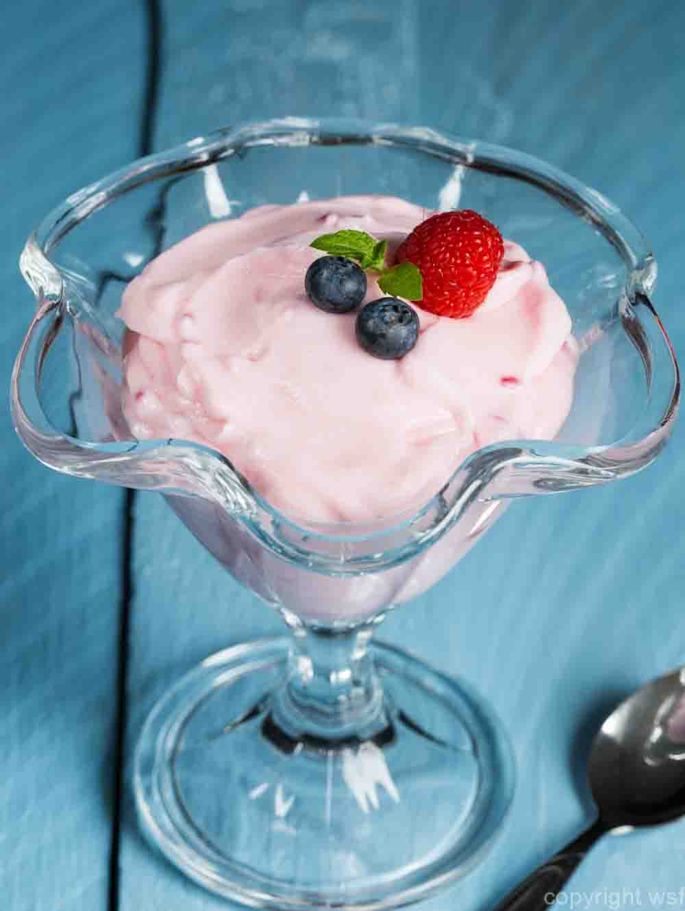 Raspberry cream dessert with mint and fruits