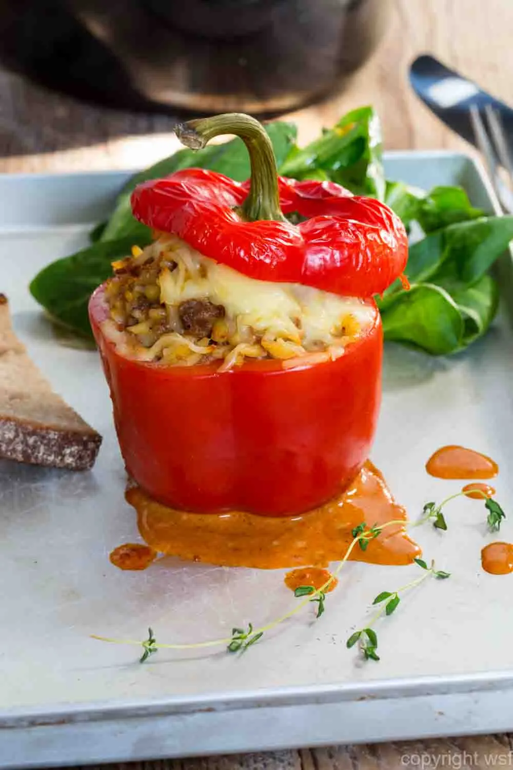 Stuffed peppers with meat sauce and cheese baked