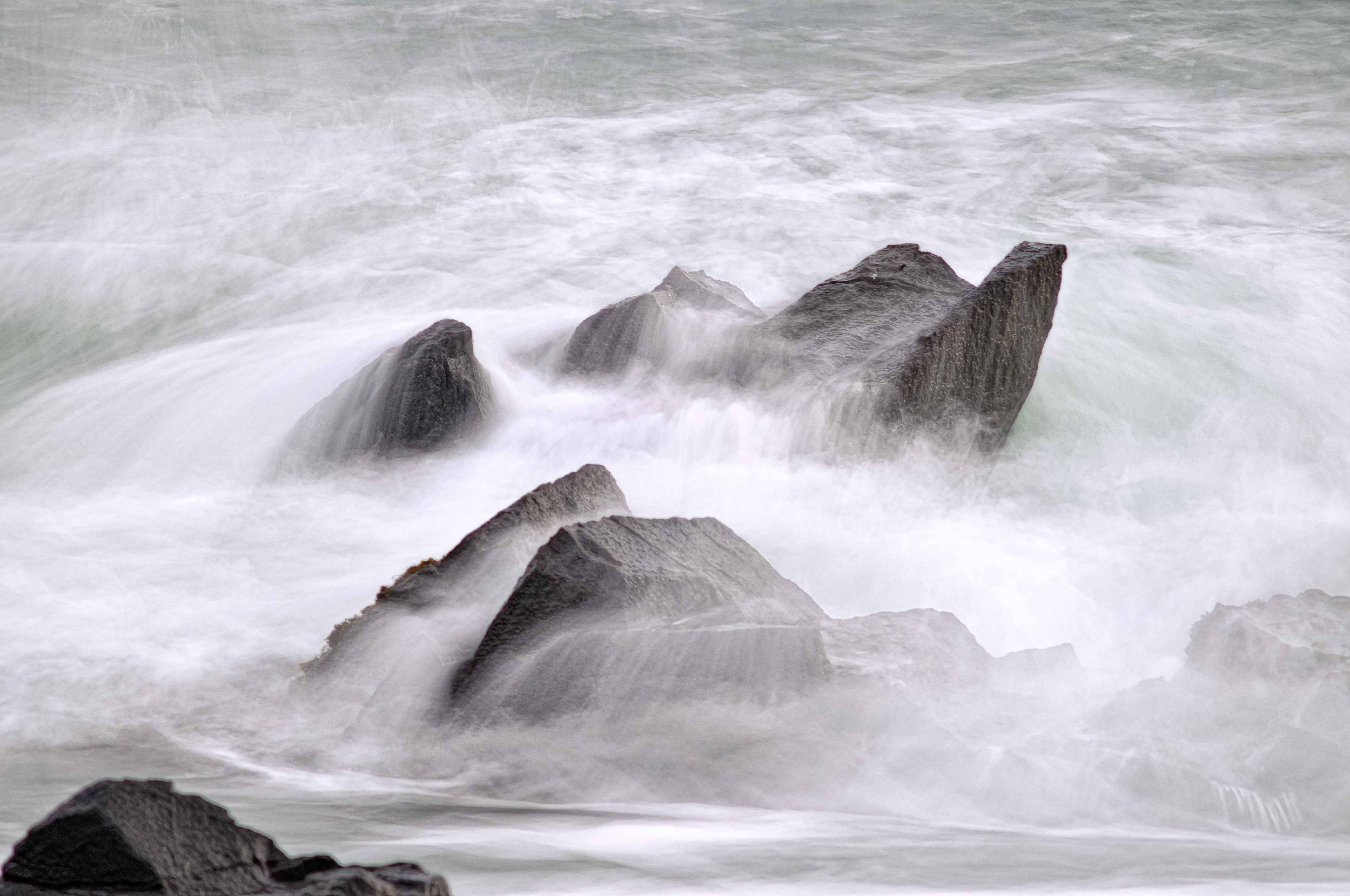 Waves washing over rocks