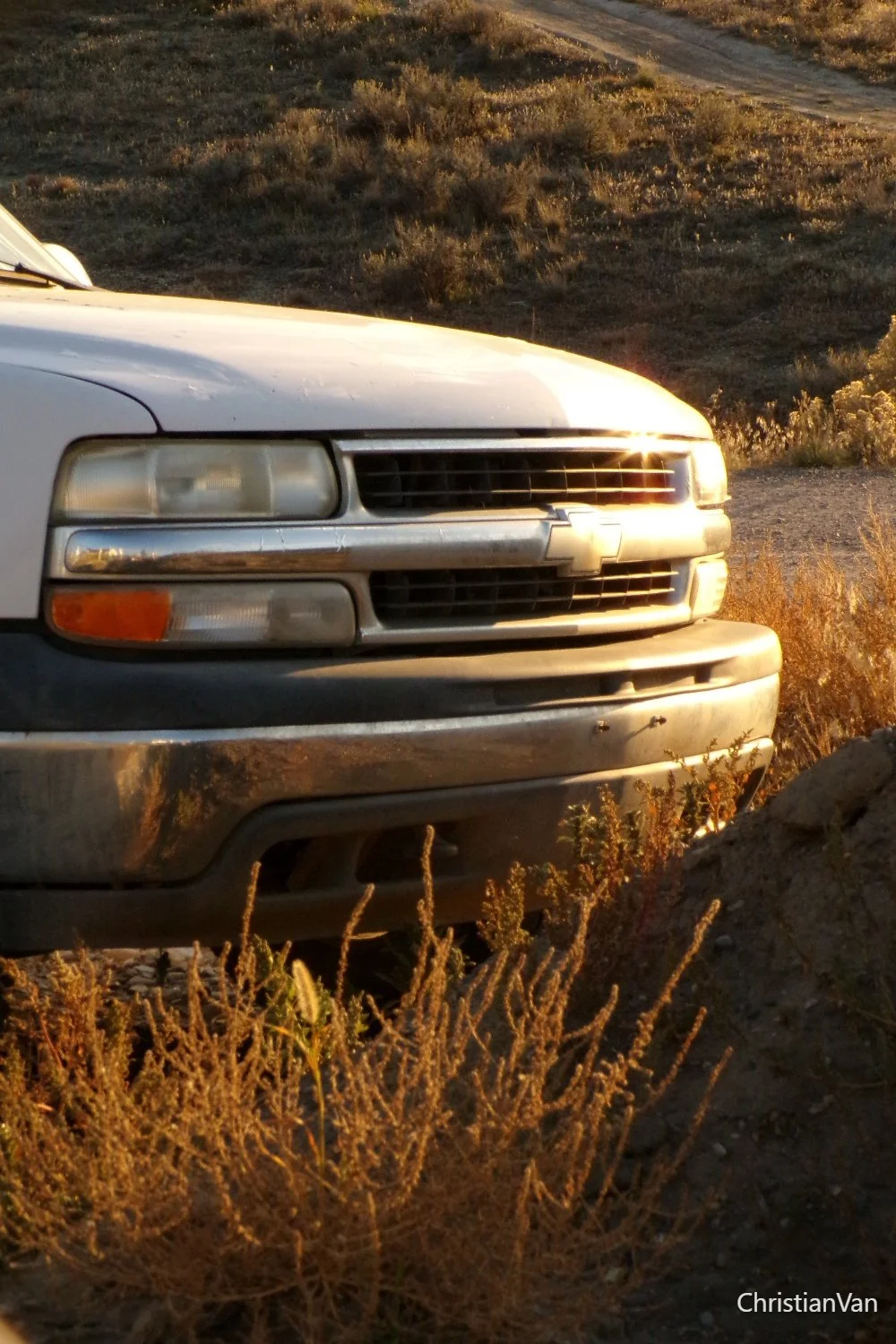 white truck at sunset.webp