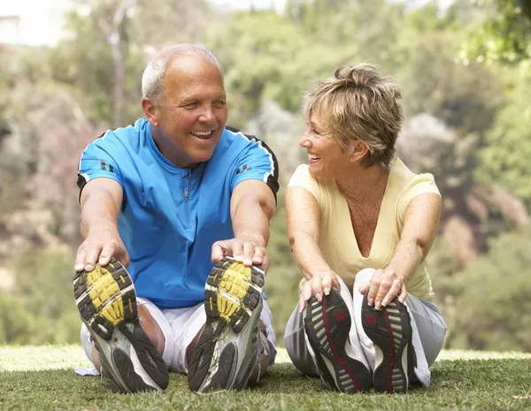 dep_4823257-Senior-Couple-Exercising-In-Park.jpg