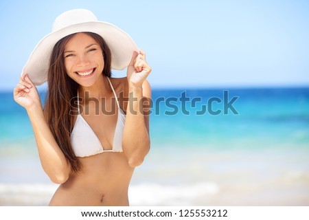 stock-photo-beach-vacation-woman-in-sun-smiling-happy-on-summer-holidays-on-tropical-beach-beautiful-125553212.jpg